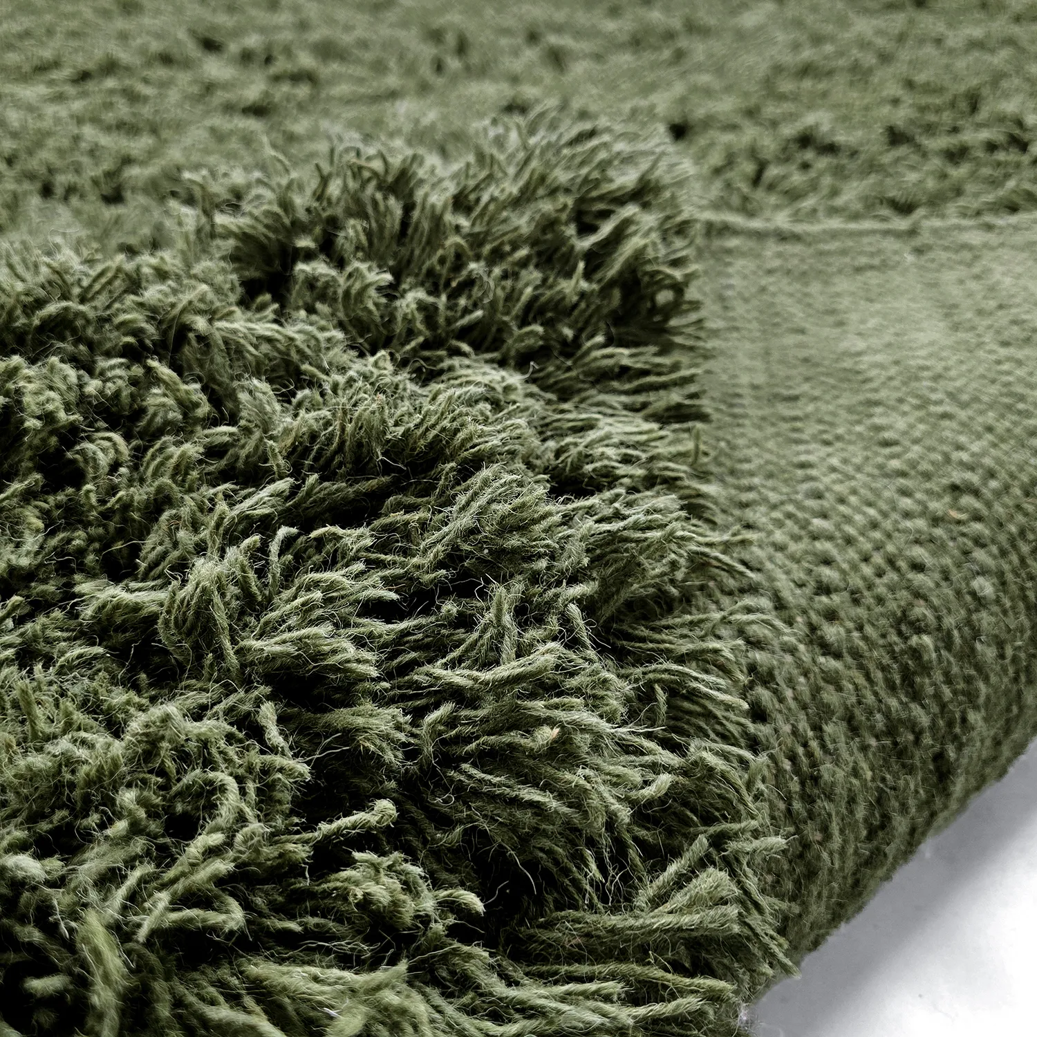 Hoogpolig vloerkleed - Fassale Hand Woven Wool Shaggy (mosgroen)